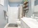 Well-lit bathroom features shower-tub combination with stylish decor at 7353 Sedgebrook W Dr, Stanley, NC 28164