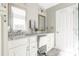 Elegant bathroom featuring double vanity sinks, granite countertops, and updated fixtures at 7353 Sedgebrook W Dr, Stanley, NC 28164
