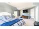 Spacious bedroom with a TV, large bed, and plenty of natural light at 7353 Sedgebrook W Dr, Stanley, NC 28164