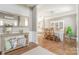Spacious dining room featuring a large mirror and hardwood flooring at 7353 Sedgebrook W Dr, Stanley, NC 28164