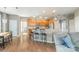Open concept kitchen with wood cabinets, granite countertops, and a breakfast bar with seating at 7353 Sedgebrook W Dr, Stanley, NC 28164