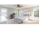 Serene main bedroom with natural light, a ceiling fan, and a cozy sitting area at 7353 Sedgebrook W Dr, Stanley, NC 28164