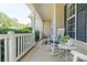 Welcoming porch with rocking chair and views of the lush greenery at 7353 Sedgebrook W Dr, Stanley, NC 28164