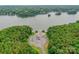 Aerial view of the lake with boat ramp, highlighting the community's access to water activities and serene surroundings at 8225 Long Island Rd, Catawba, NC 28609