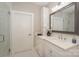 Bright bathroom featuring a white countertop, cabinets, and door leading to the shower at 8225 Long Island Rd, Catawba, NC 28609