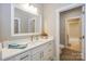 Well-lit bathroom with white cabinets, a spacious countertop, and modern fixtures at 8225 Long Island Rd, Catawba, NC 28609