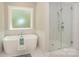 Bathroom with free-standing tub and glass-enclosed shower at 8225 Long Island Rd, Catawba, NC 28609