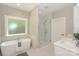 Bathroom with free-standing tub, glass-enclosed shower, and double vanity at 8225 Long Island Rd, Catawba, NC 28609