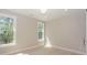 Light-filled bedroom with hardwood flooring and windows with views of the trees at 8225 Long Island Rd, Catawba, NC 28609