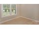 Bright bedroom with hardwood floors and a large window that offers ample natural light at 8225 Long Island Rd, Catawba, NC 28609