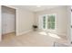 Bright bedroom with white trim, doors, and light hardwood flooring at 8225 Long Island Rd, Catawba, NC 28609