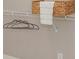 Wire shelving with hangers, a woven basket, and a folded white towel at 8225 Long Island Rd, Catawba, NC 28609