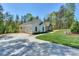 Exterior view of the home featuring a white exterior, attached garage, and a long driveway at 8225 Long Island Rd, Catawba, NC 28609