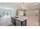 Kitchen island with white countertop and stainless dishwasher, in an open-concept design at 8225 Long Island Rd, Catawba, NC 28609