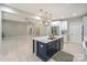 Open-concept kitchen with a large island, stainless steel appliances, and adjacent living space, perfect for entertaining at 8225 Long Island Rd, Catawba, NC 28609