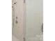 Close-up of shower with marble surround and glass door at 8225 Long Island Rd, Catawba, NC 28609