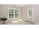 Cozy sunroom featuring large windows and a glass door leading to the outside deck at 8225 Long Island Rd, Catawba, NC 28609