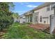 A well-maintained backyard features a brick patio and manicured lawn at 831 Daly Cir, Fort Mill, SC 29715