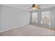 A bedroom with a ceiling fan and two windows bringing in light at 831 Daly Cir, Fort Mill, SC 29715