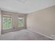 Bedroom with natural light from two large windows at 831 Daly Cir, Fort Mill, SC 29715