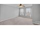 A bright bedroom with a ceiling fan and large windows at 831 Daly Cir, Fort Mill, SC 29715
