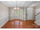 Bright dining room featuring hardwood floors, bay windows and elegant chandelier at 831 Daly Cir, Fort Mill, SC 29715