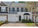 Charming two-story townhouse with a well-maintained front yard and attached garage at 831 Daly Cir, Fort Mill, SC 29715