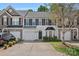 A beautiful townhome featuring a two-car garage and landscaped front yard at 831 Daly Cir, Fort Mill, SC 29715