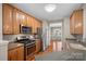 Contemporary kitchen with stainless steel appliances and a view of the dining area at 831 Daly Cir, Fort Mill, SC 29715