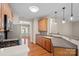 Functional kitchen with wood cabinets, stainless steel appliances, and hardwood floors at 831 Daly Cir, Fort Mill, SC 29715