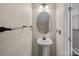 Powder room features a pedestal sink, decorative mirror, and convenient location at 831 Daly Cir, Fort Mill, SC 29715