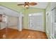 Open concept sunroom with great natural light, hardwood floors and ceiling fan at 831 Daly Cir, Fort Mill, SC 29715