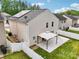 Aerial view of backyard with patio, vinyl siding, and solar panels at 9612 Eagle Feathers Dr, Charlotte, NC 28214