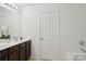 Bright bathroom with double vanity and modern fixtures at 9612 Eagle Feathers Dr, Charlotte, NC 28214