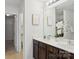 Bathroom with double vanity and a view into the water closet at 9612 Eagle Feathers Dr, Charlotte, NC 28214