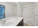 Bright bathroom with double vanity and shower-tub combo at 9612 Eagle Feathers Dr, Charlotte, NC 28214