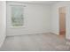 Well-lit bedroom with a window and a closet at 9612 Eagle Feathers Dr, Charlotte, NC 28214