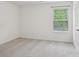 Carpeted bedroom featuring a large window and neutral paint at 9612 Eagle Feathers Dr, Charlotte, NC 28214
