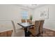 Elegant dining room showcasing modern lighting, neutral walls, and stylish table seating for dinner parties at 9612 Eagle Feathers Dr, Charlotte, NC 28214