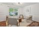 Bright living room with natural light, neutral paint, and comfortable seating area with a round coffee table at 9612 Eagle Feathers Dr, Charlotte, NC 28214