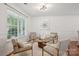 Bright living room with natural light, neutral paint, and comfortable seating area with a round coffee table at 9612 Eagle Feathers Dr, Charlotte, NC 28214