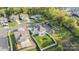 Aerial view showcasing a neighborhood with well-maintained lawns and a community pool at 1003 Dorsey Dr, Fort Mill, SC 29715
