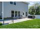 Well-maintained backyard with patio, seating, grill, and green grass at 1003 Dorsey Dr, Fort Mill, SC 29715