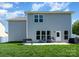 A spacious backyard featuring a patio with seating and lush green grass at 1003 Dorsey Dr, Fort Mill, SC 29715