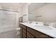 Bathroom with double vanity and dark wood cabinets, with shower and tub at 1003 Dorsey Dr, Fort Mill, SC 29715