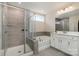 Elegant bathroom featuring a separate shower and soaking tub with gray tiled walls at 1003 Dorsey Dr, Fort Mill, SC 29715