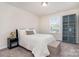 Bright bedroom with neutral walls and carpet with a large window for natural light at 1003 Dorsey Dr, Fort Mill, SC 29715