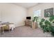 Minimalist bedroom with neutral tones, large window and monstera plant at 1003 Dorsey Dr, Fort Mill, SC 29715