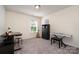 Well-lit bedroom with desk, guitar, and keyboard, ideal for hobbies or study at 1003 Dorsey Dr, Fort Mill, SC 29715
