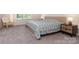 Cozy bedroom featuring a plush bed, accent chair and natural light at 1003 Dorsey Dr, Fort Mill, SC 29715